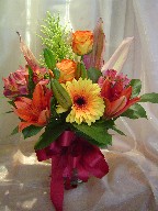 Gerbera, roses, alstroemeria, lillies, and solidago