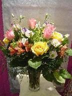 Roses, lisianthus, solidago, and alstroemeria