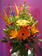 Heliconia, solidago, iris, gerbera, lillies, and eucalyptus