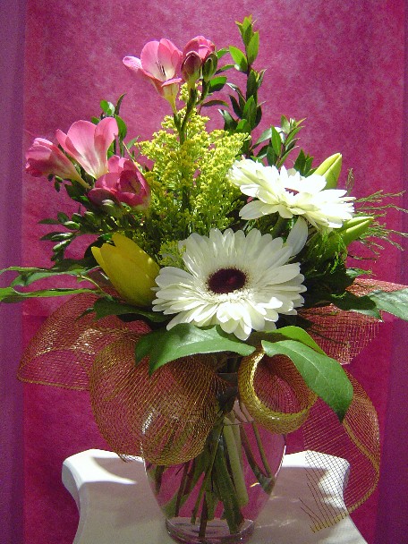 Gerbera, fresia, alstroemeria, solidago, tulips, and myrtle