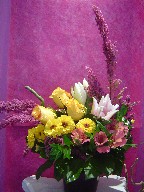 Roses, heather, pinnochio, tulips, alstroemeria, lillies, and curly willow
