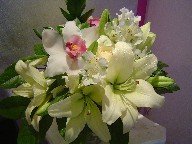 Cymbidium orchids, roses, lillies, alstroemeria, and ruscus
