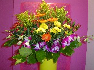 Orchids, gerbera, solidago, daisies, and coffee beans