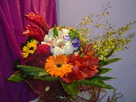 Gerbera, lillies, celosia, roses, alstroemeria, ginger, lisianthus, orchids, and sunflowers