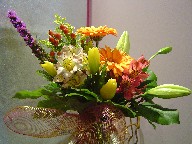 Gerbera, alstroemeria, liatris, berries, tulips, and solidago