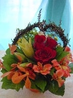 Roses, lillies, alstroemeria, monkara orchids, daisies, and thryptomene