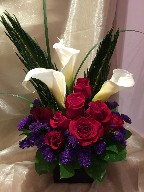 Calla lilies, red roses, statice and bear grass