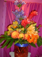 Ginger, gerbera, roses, cymbidium orchids, agapanthus, coffee beans, lillies, and monstera
