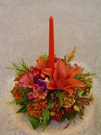 Asiatic lilies, alstroemeria, daisies, hypericum, cedar, and Christmas decorations