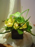 Cymbidium orchids, anthurium, monkey grass, and greens