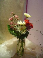 Gerbera, celosia, waxflowers, and monkey grass