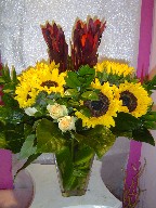 Sunflowers, roses, and eucadendron