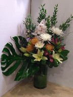 Cymbidium orchids, protea, asiatic lillies, spider mums, alstroemeria, lisianthus, myrtle and monstera