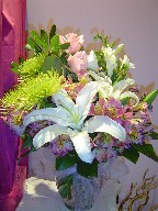 Fresia, roses, spider mum, lillies, and alstroemeria