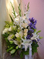 Agapanthus, gladiolas, roses, lillies, spider mum, and solidago
