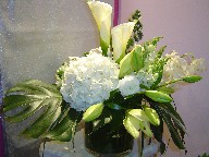 Calla lillies, hydreangea, orchids, snapdragon, lillies, ranunculus, and monstera