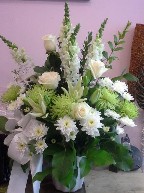 Roses, snapdragon, asiatic lillies, spider mums, flat mums, and myrtle