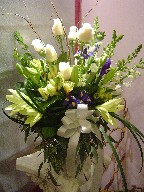 Roses, iris, lillies, alstroemeria, snapdragon, myrtle, and monkey grass