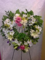 Roses, alstroemeria, lillies, fresia, daisies, variegated pitt, Italian ruscus, and seed eucalyptus