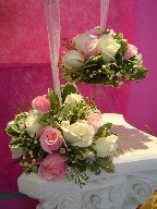 Roses, variegated pitt, and waxflowers