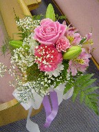 Roses, lillies, carnations, and baby's breath