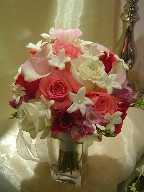 Roses, stephanotis, calla lillies, and fresia