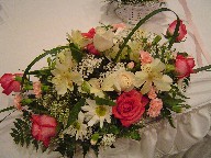 Roses, daisies, alstroemeria, baby's breath, and carnations
