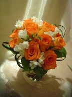 Roses, fresia, and monkey grass
