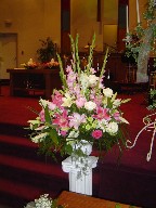 Snapdragon, gladiolas, roses, lillies, and pompoms (all around arrangement)