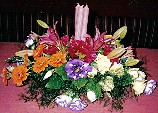 Roses, gerbera, lisianthus, lilies and candles