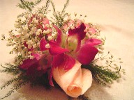 Rose, orchids, and baby's breath