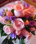 Roses, fresia, tulips, and magnolia leaves