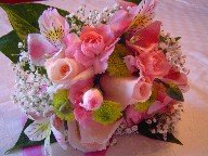 Roses, carnations, pompoms, alstroemeria, and baby's breath