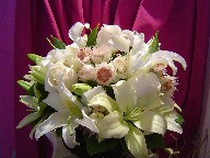 Blushing bride, roses, alstroemeria, and lillies