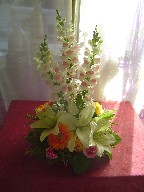 Snapdragon, yellow roses, gerbera, and white lillies