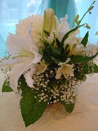 Lillies, commercial mum, orchids, alstroemeria, and baby's breath
